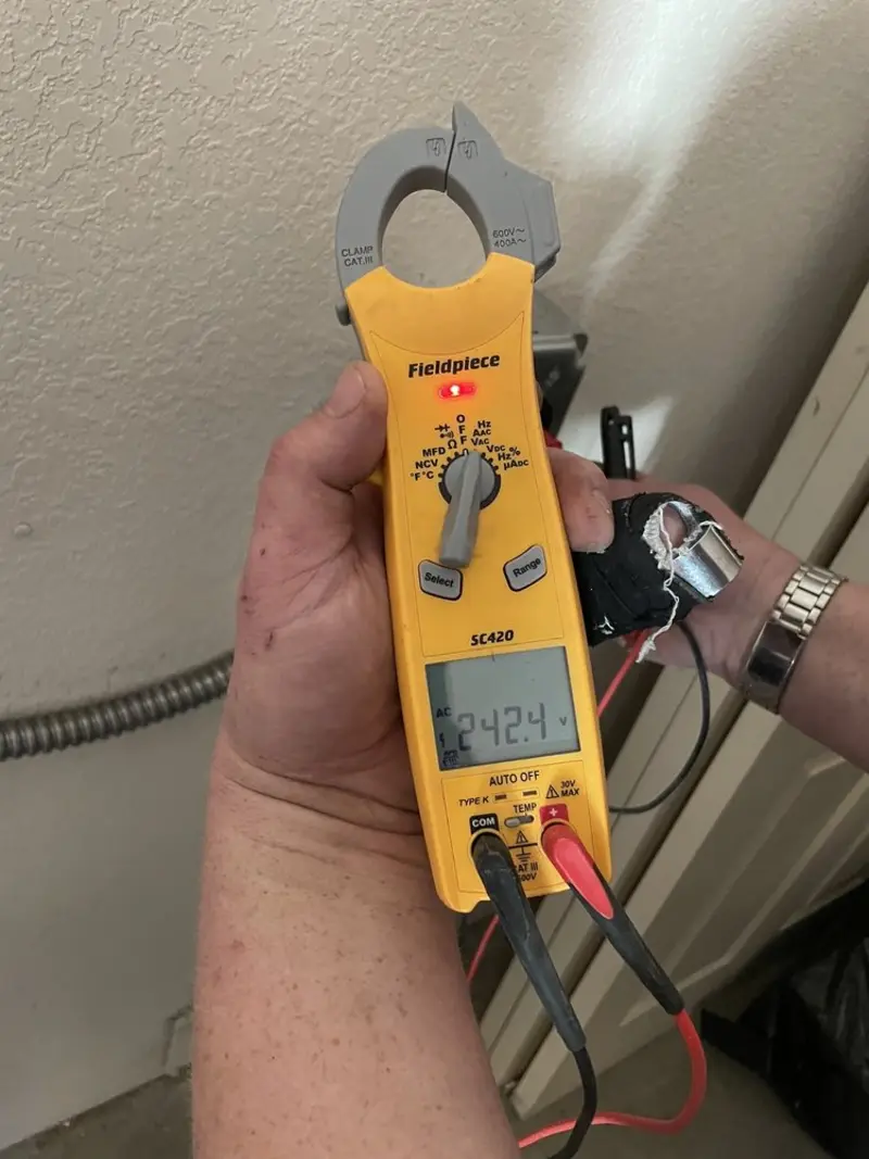 Voltage testing with clamp meter during Aluminum Wiring Replacement in Highland Park